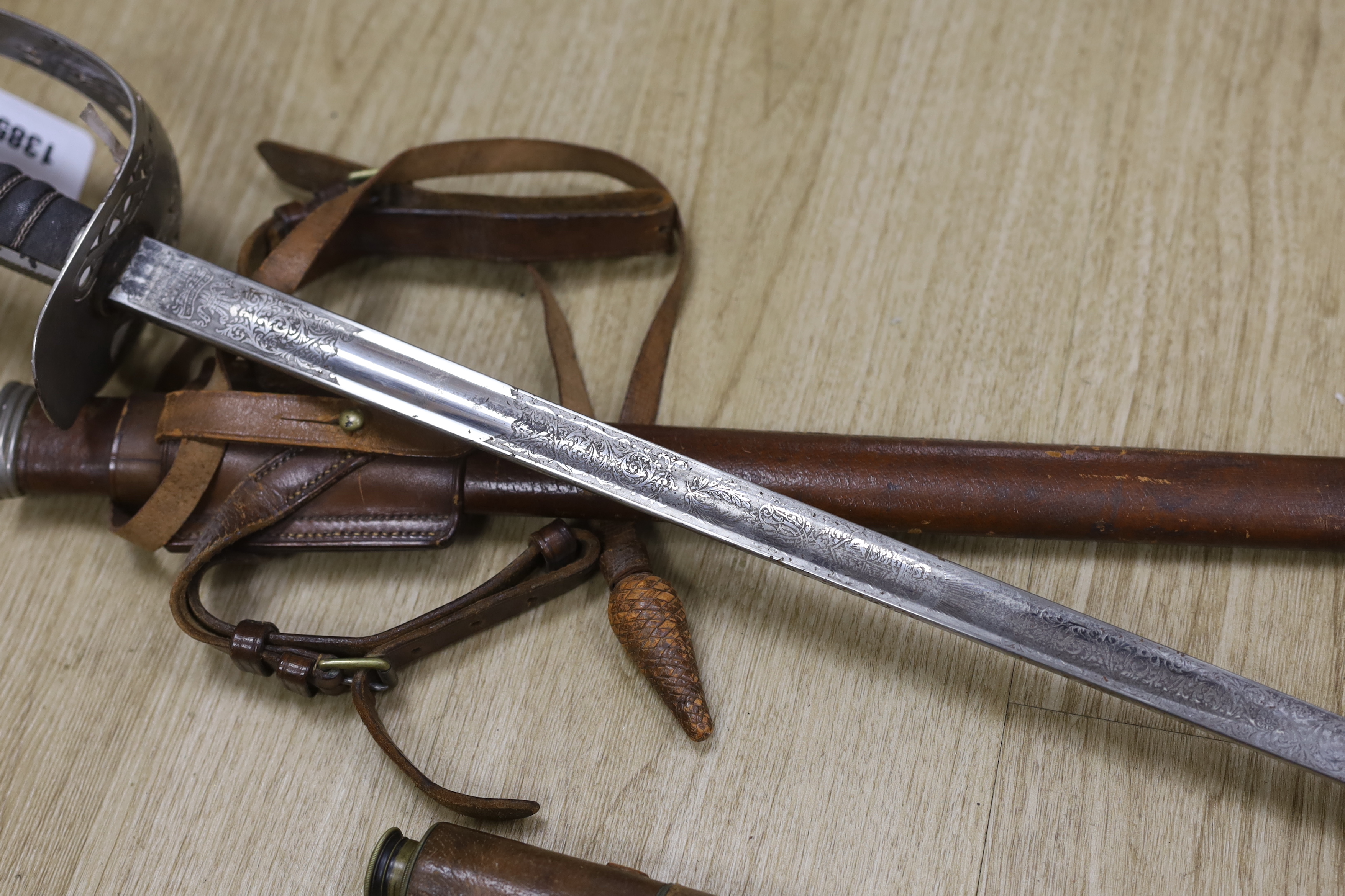 A Victorian officer’s dress sword, Wilkinson blade, together with a telescope, sword, 102cm in length